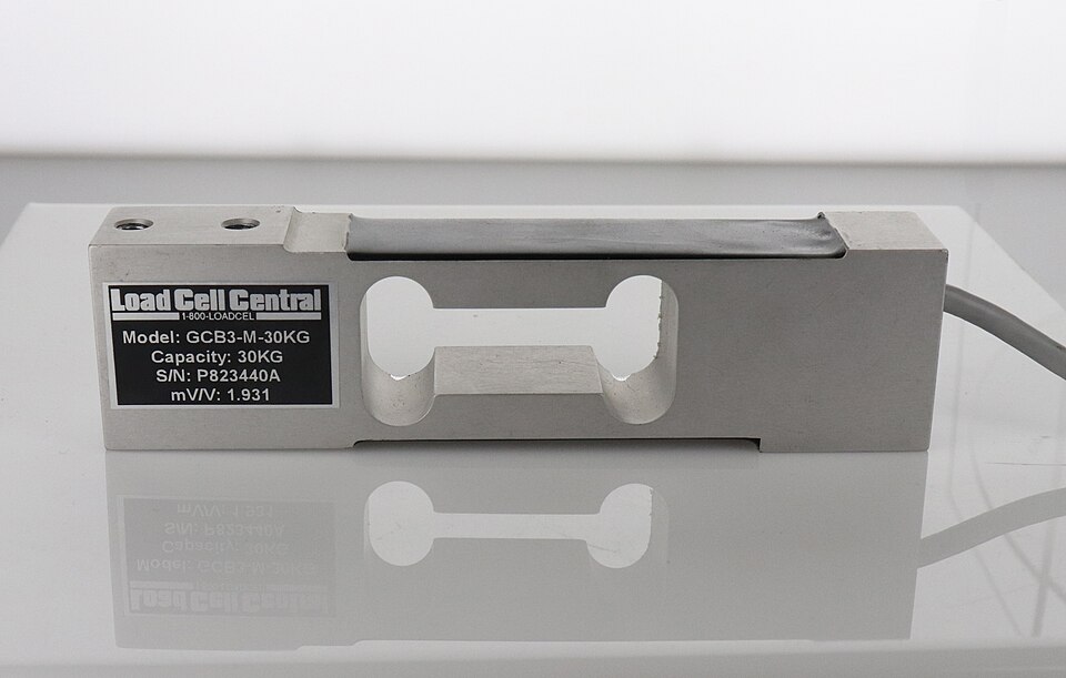 Load cell แบบ single point: แรงกดทำให้ strain gauge ภายในเปลี่ยนความต้านทาน ได้สัญญาณระดับ mV — sensor และ transducer อยู่ในชิ้นเดียวกัน